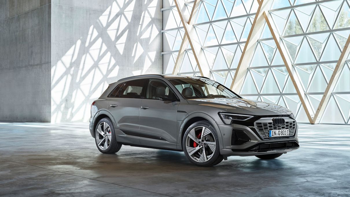 Audi Q8 stands in front of a window front