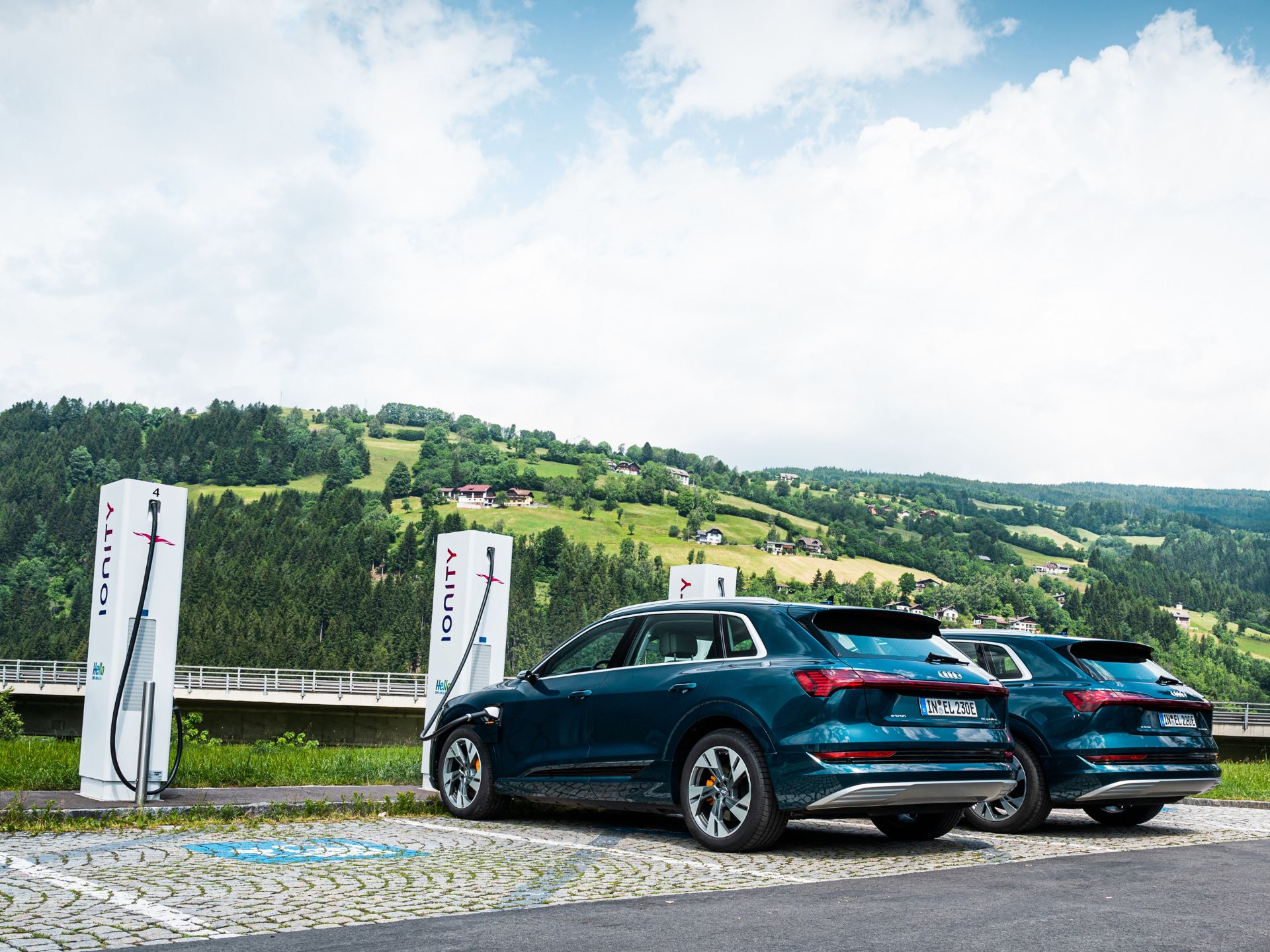 Three Audi e-trons at the IONITY quick-charging station.