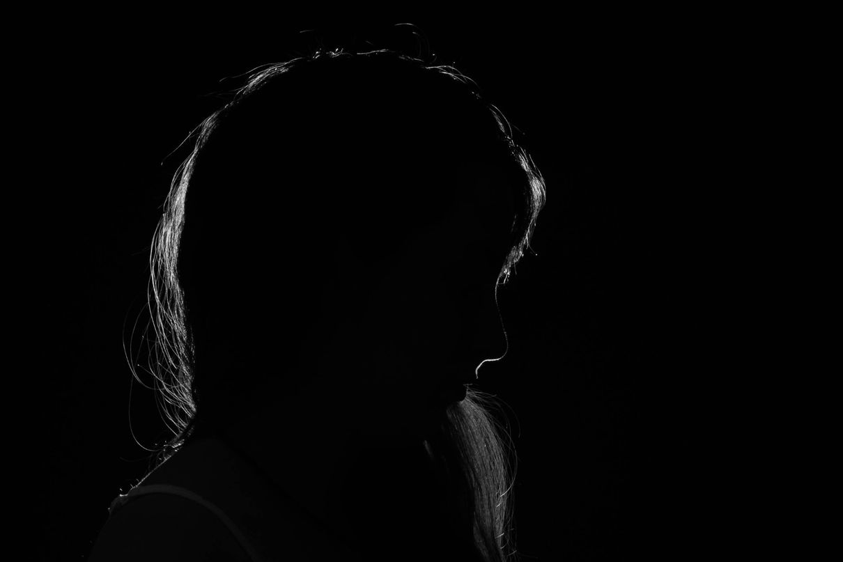 Silhouette of a woman's head in profile