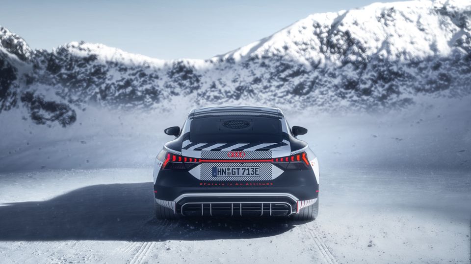 Rear view of the Audi RS e-tron GT in winter landscape