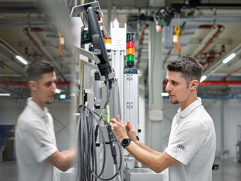Young employee working on electric mobility