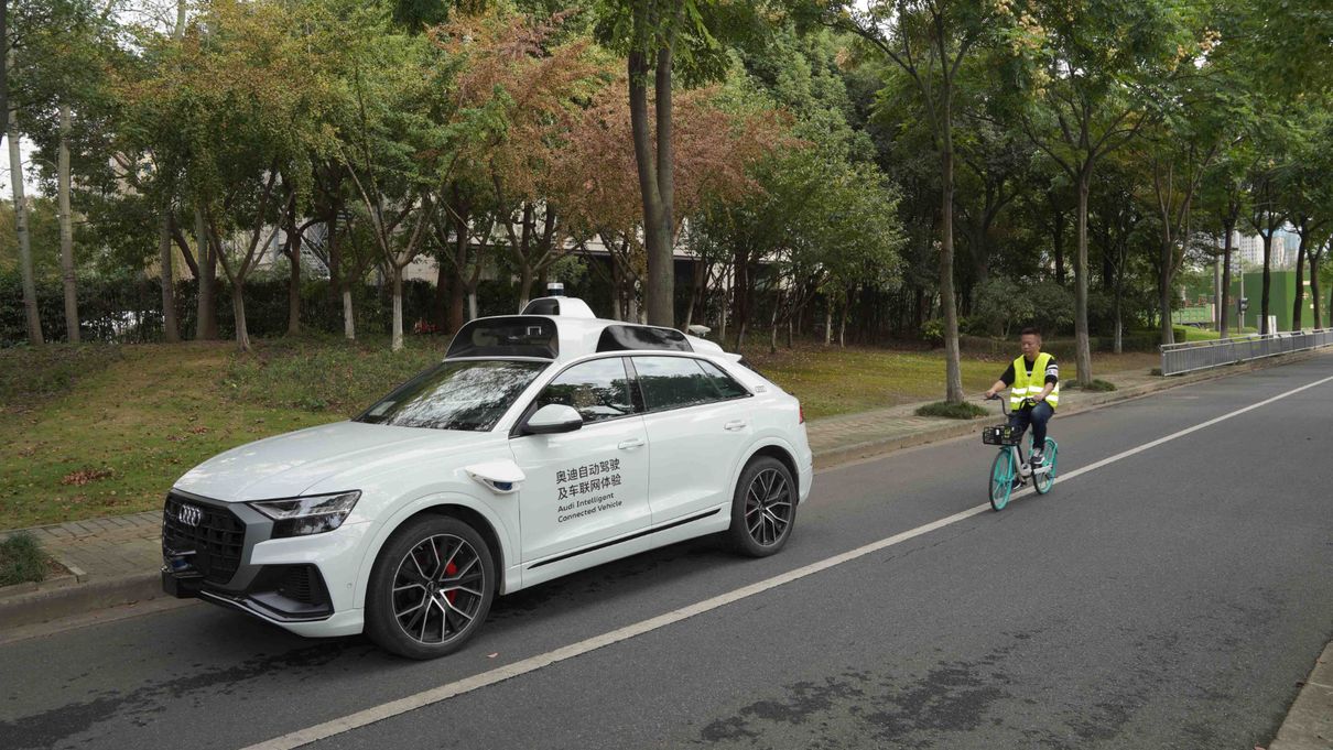 Autonomously driving Audi overtaking a cyclist