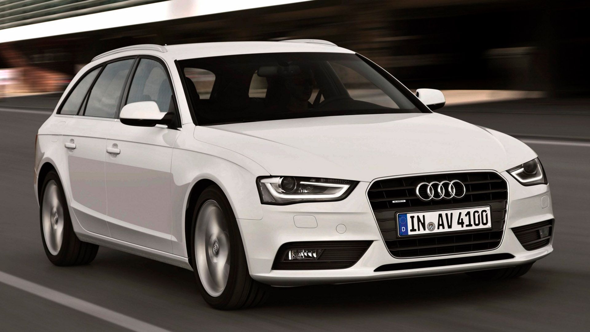 White Audi A4 Avant driving on a road
