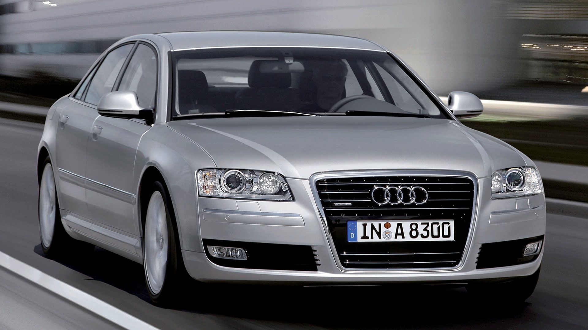 Silver Audi A8 drives onto the road