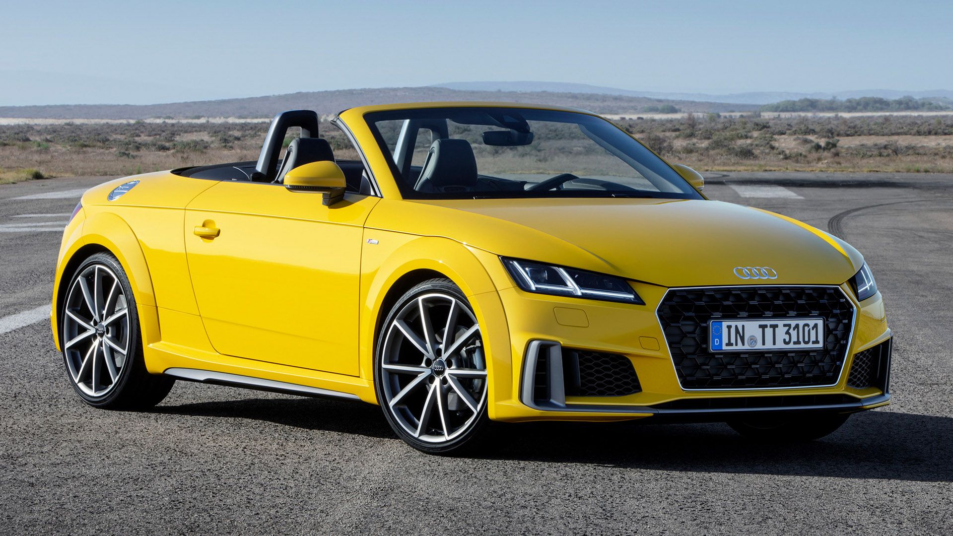 Yellow Audi TT Roadster on the carriageway
