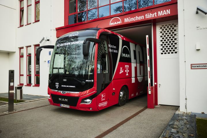 Club bus of FC Bayern drives out of the garage
