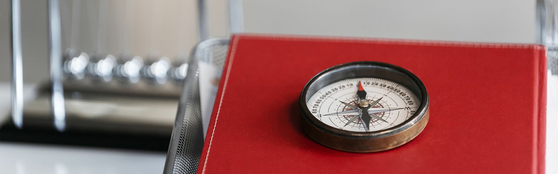 Red compass on a table